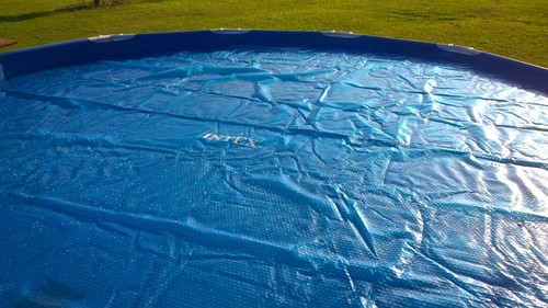 Intex 28015E Solar Pool Cover: for 18ft Round Easy Set and Metal Frame Pools - Insulates Pool Water - Reduces Water Evaporation - Keeps Debris Out - Reduces Chemical Consumption customer photo 2