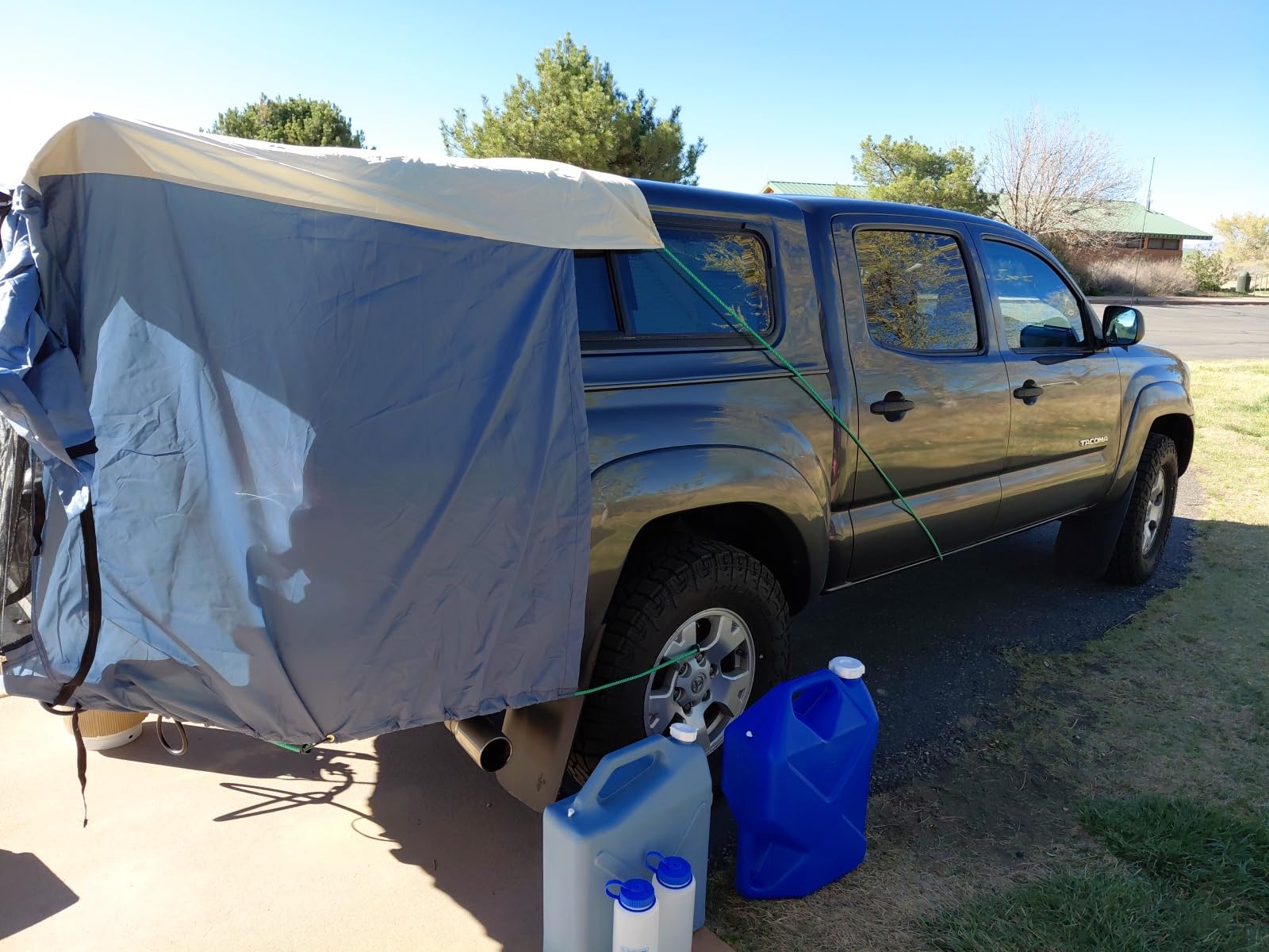 DAC Full-Size Truck Bed Tent for Caps - Fits Ford F-150, Chevy Silverado, Toyota Tundra, Tacoma (2005+), Tailgate >= 58″ – Converts Truck with Cap into Camping Tent customer photo 1″ class=”wp-image-customer”/></figure>


<p>At just 3.8 pounds and packing down to 11 inches by 11 inches by 6 inches, this tent stores easily in most truck cargo areas. The quick-release buckles allowed us to remove and reinstall the tent multiple times during our testing week without any difficulty. This proved valuable when we needed to access the truck bed for larger gear.</p>
<p>Water resistance proved adequate for light rain but fell short during heavy downpours. We experienced minor leakage around the tailgate seal area during a 3-inch overnight storm. The gaps near the tailgate also allowed small gnats to enter on one evening. These limitations make this tent best suited for fair-weather camping rather than all-season use.</p>


<figure class=