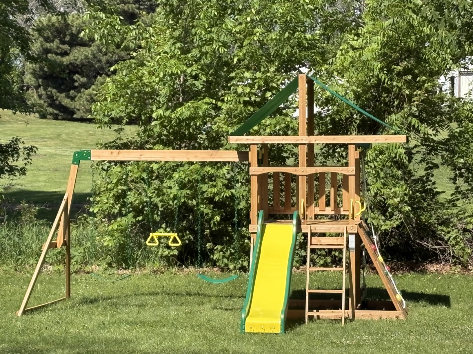 Backyard Discovery Mount McKinley Cedar Wood Swing Set with Wave Slide, Play Deck, Double Rock Wall, Rope Ladder, Web Swing, Belt Swings, Toy Telescope, Steering Wheel, Sandbox Area, Outdoor Playset customer photo 1
