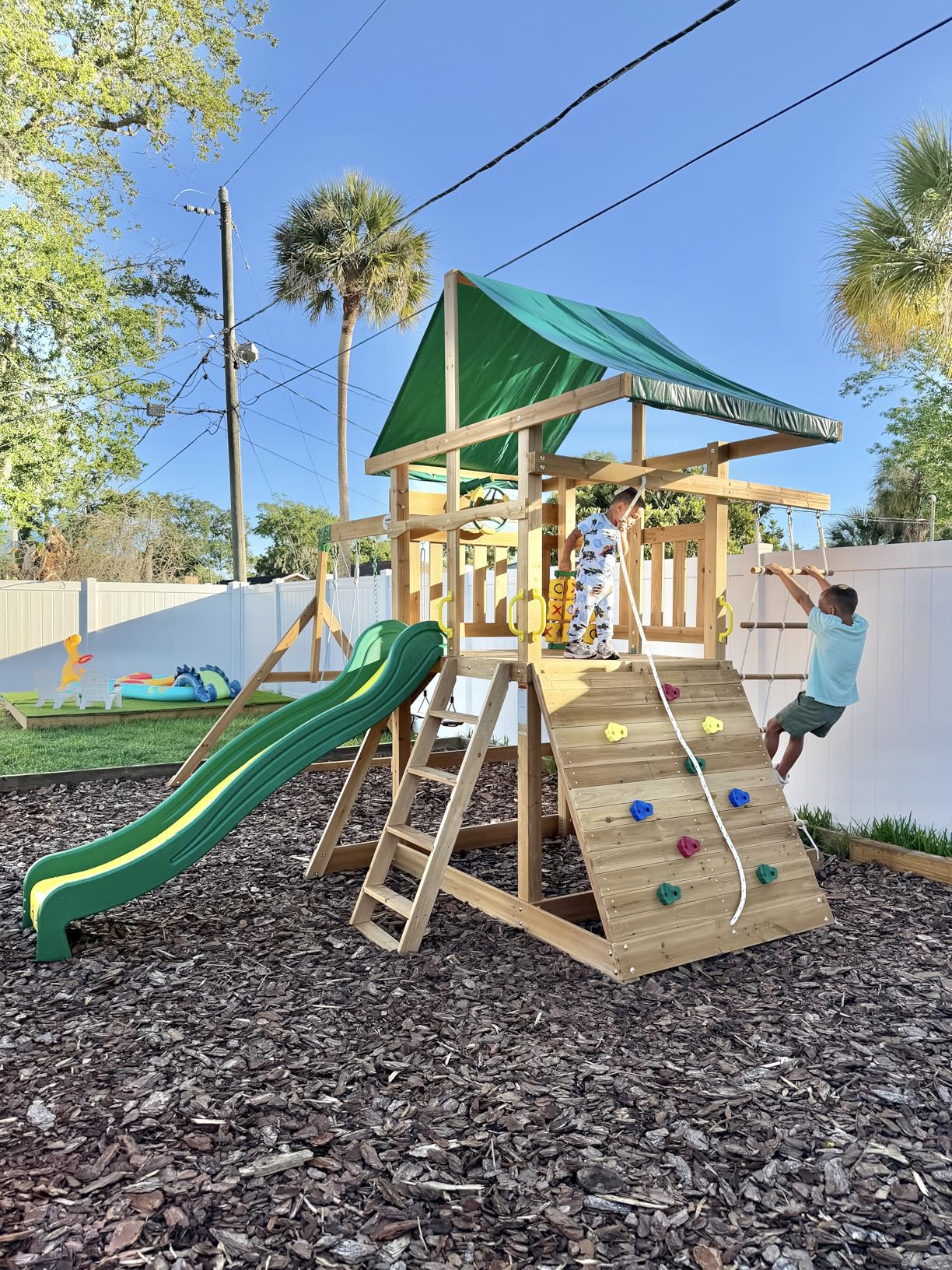 Backyard Discovery Mount McKinley Cedar Wood Swing Set with Wave Slide, Play Deck, Double Rock Wall, Rope Ladder, Web Swing, Belt Swings, Toy Telescope, Steering Wheel, Sandbox Area, Outdoor Playset customer photo 2