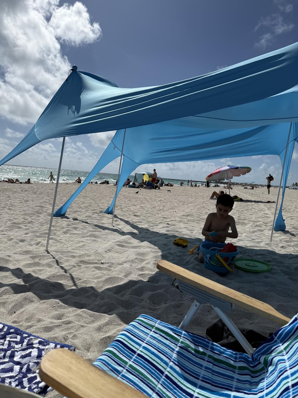 Rhino Valley Beach Tent, 10 x 10 FT Beach Shade UPF50+ Protection, Beach Canopy with 8 Sandbags 4 Stability Poles, Outdoor Beach Tent Sun Shelter Umbrella for Sand,Camping,Fishing Essentials, Sky Blue customer photo 1