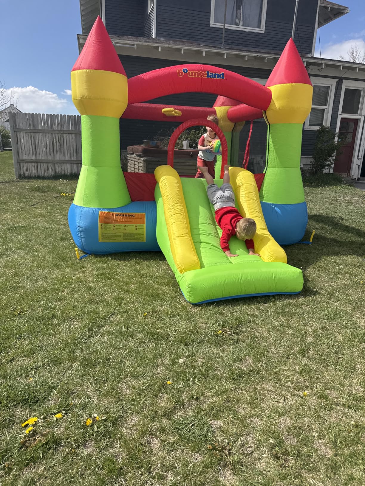 Bounceland Bounce House Castle with Basketball Hoop Inflatable Bouncer, Fun Slide, Safe Entrance Opening, UL Certified Strong Blower Included, 12 ft x 9 ft x 7 ft H customer photo 1