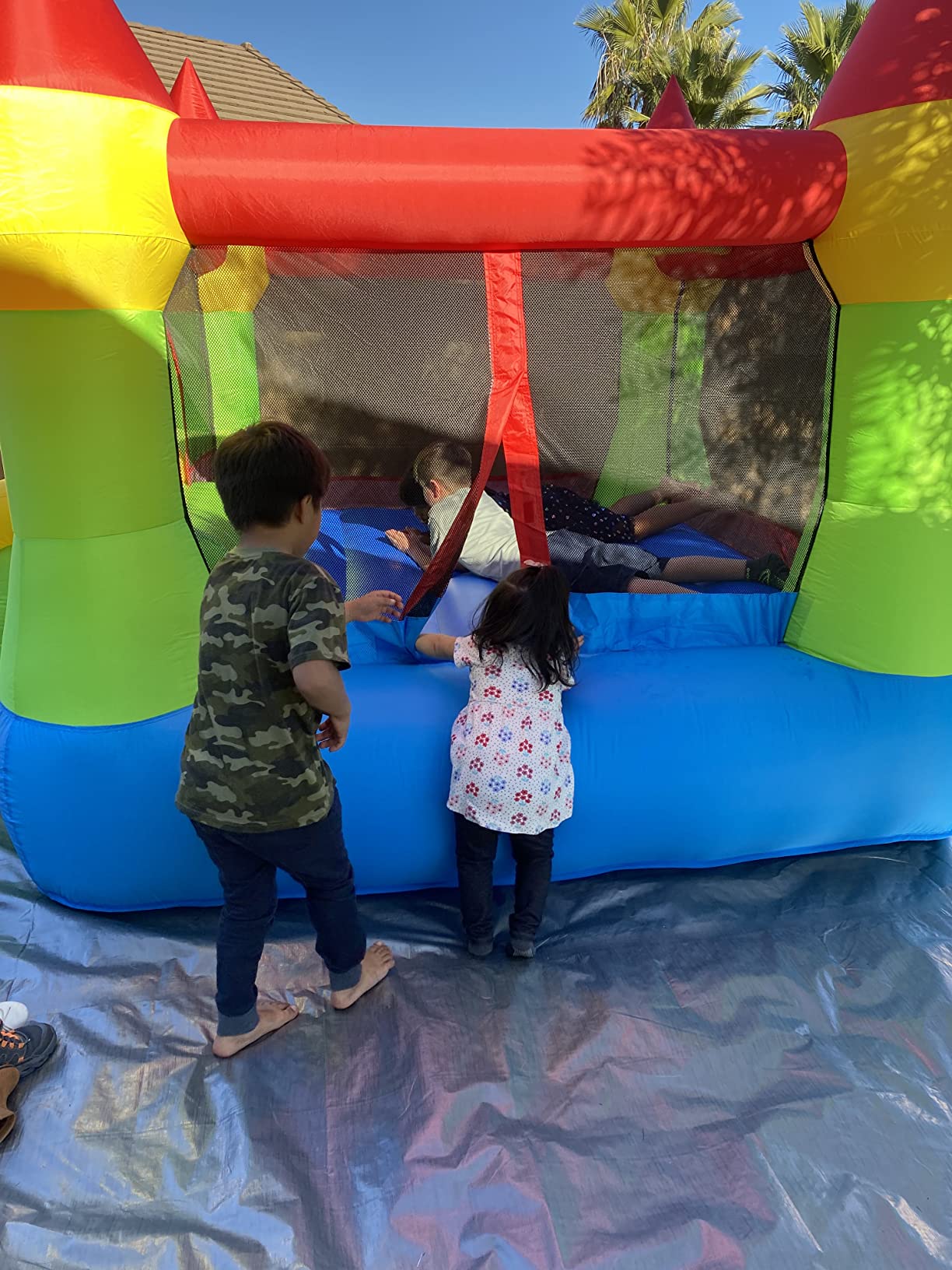 Bounceland Bounce House Castle with Basketball Hoop Inflatable Bouncer, Fun Slide, Safe Entrance Opening, UL Certified Strong Blower Included, 12 ft x 9 ft x 7 ft H customer photo 2