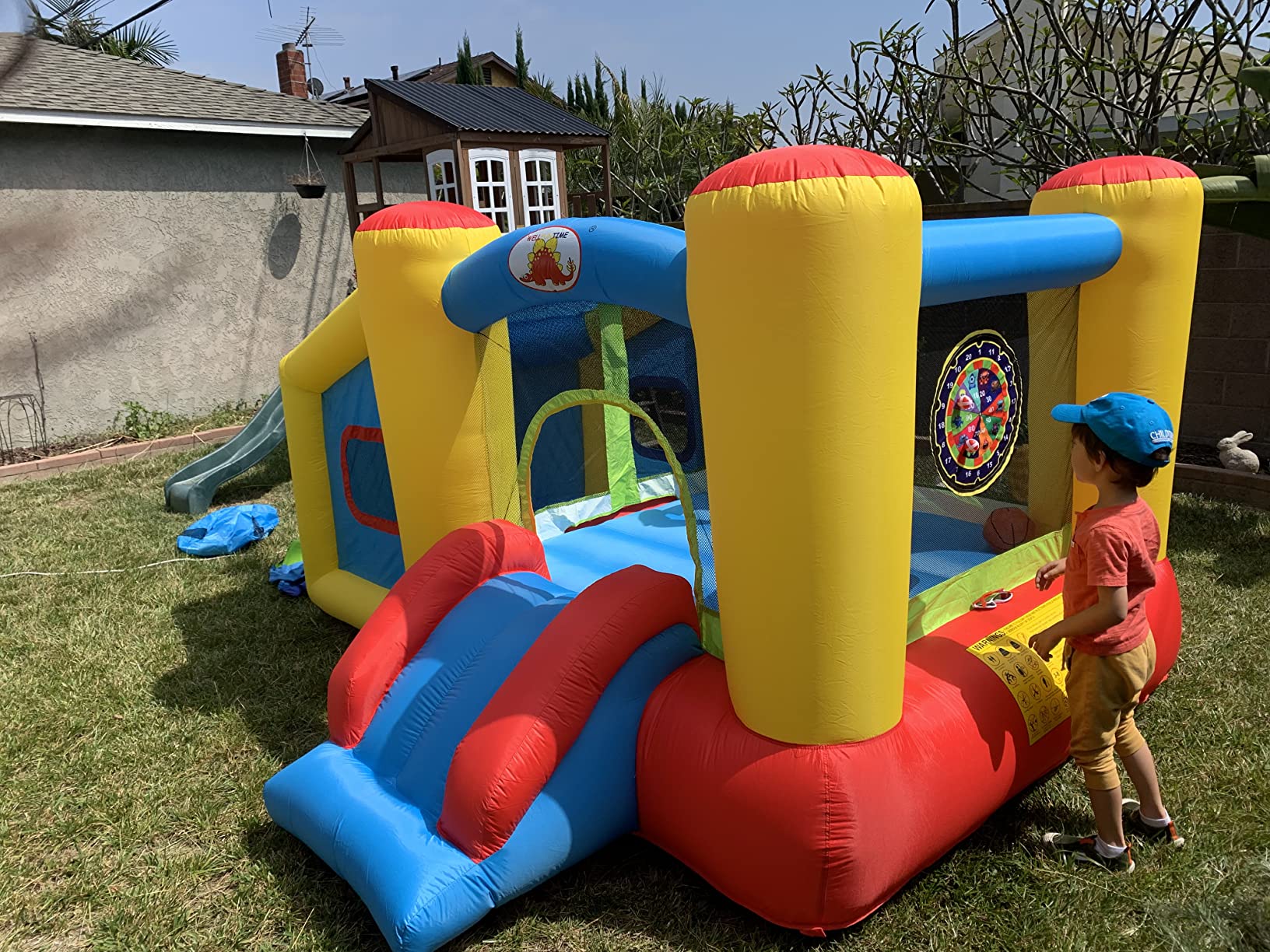 WELLFUNTIME Inflatable Bounce House with Blower, Jumping Castle Slide | Kids Bouncer with Ball Pit, Basketball Hoop, Dart Target Game, Ages 3-8 (112x100x63 Inch) customer photo 1