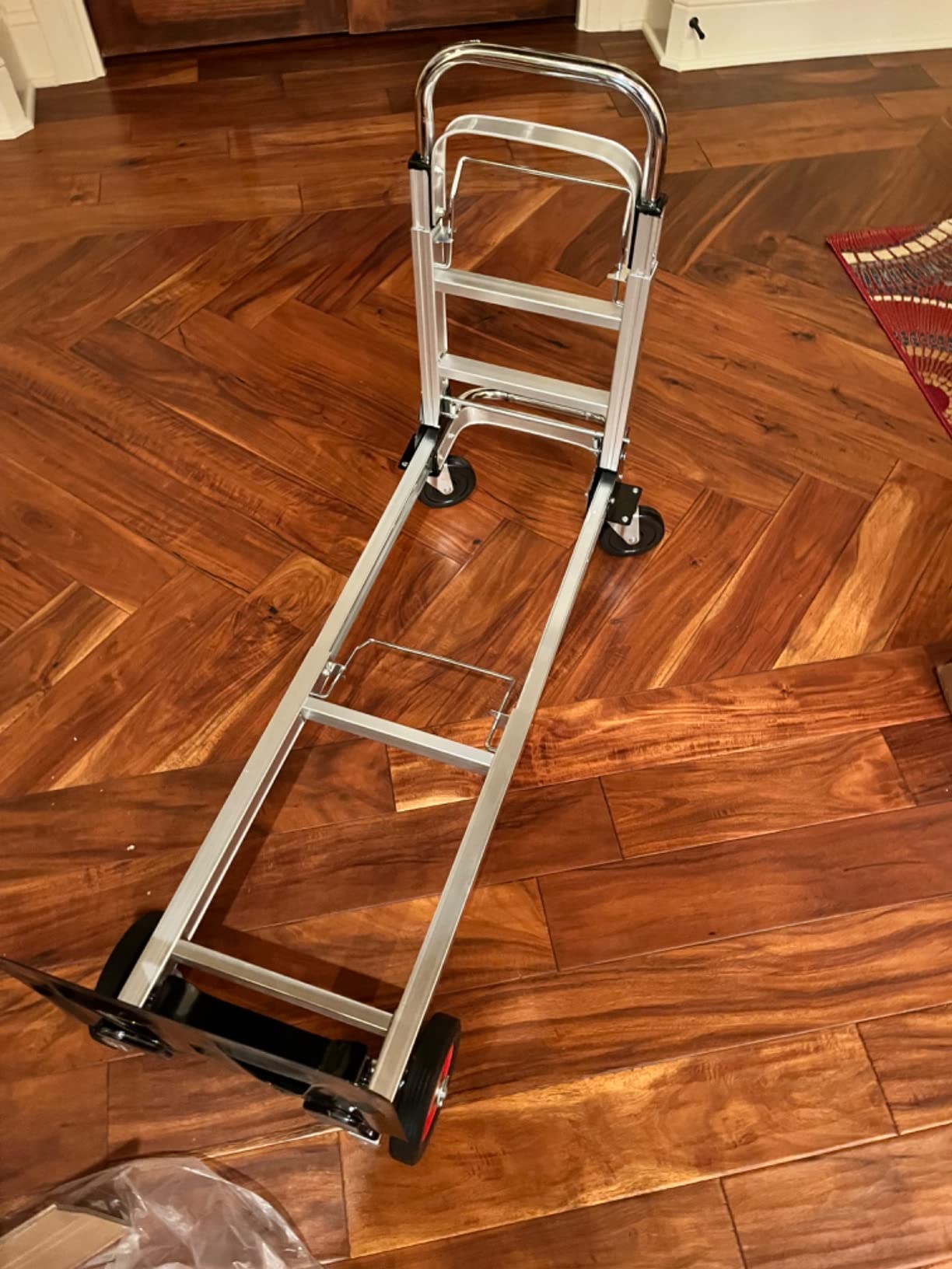 Suzhi Foldable Hand Truck Moving Dolly Cart with 4 Wheels, 500 Lbs Load, 2 Straps, Pre-Assembled, Save Room, Easy Folding Dolly for Furniture, Appliances, Boxes, Warehouse & Office Transport customer photo 1