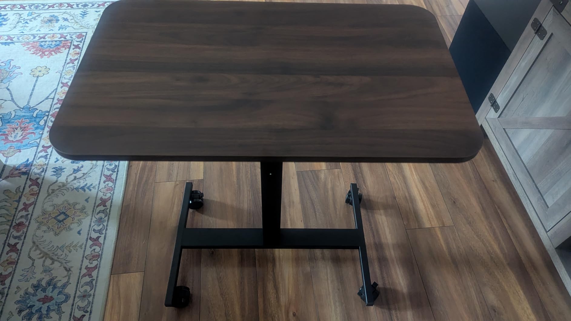 HUANUO Small Rolling Laptop Standing Desk, Height Adjustable Mobile T-Base Desk with Lockable Casters, Portable Sit-Stand Workstation for Bedside & Sofa, Walnut customer photo 1