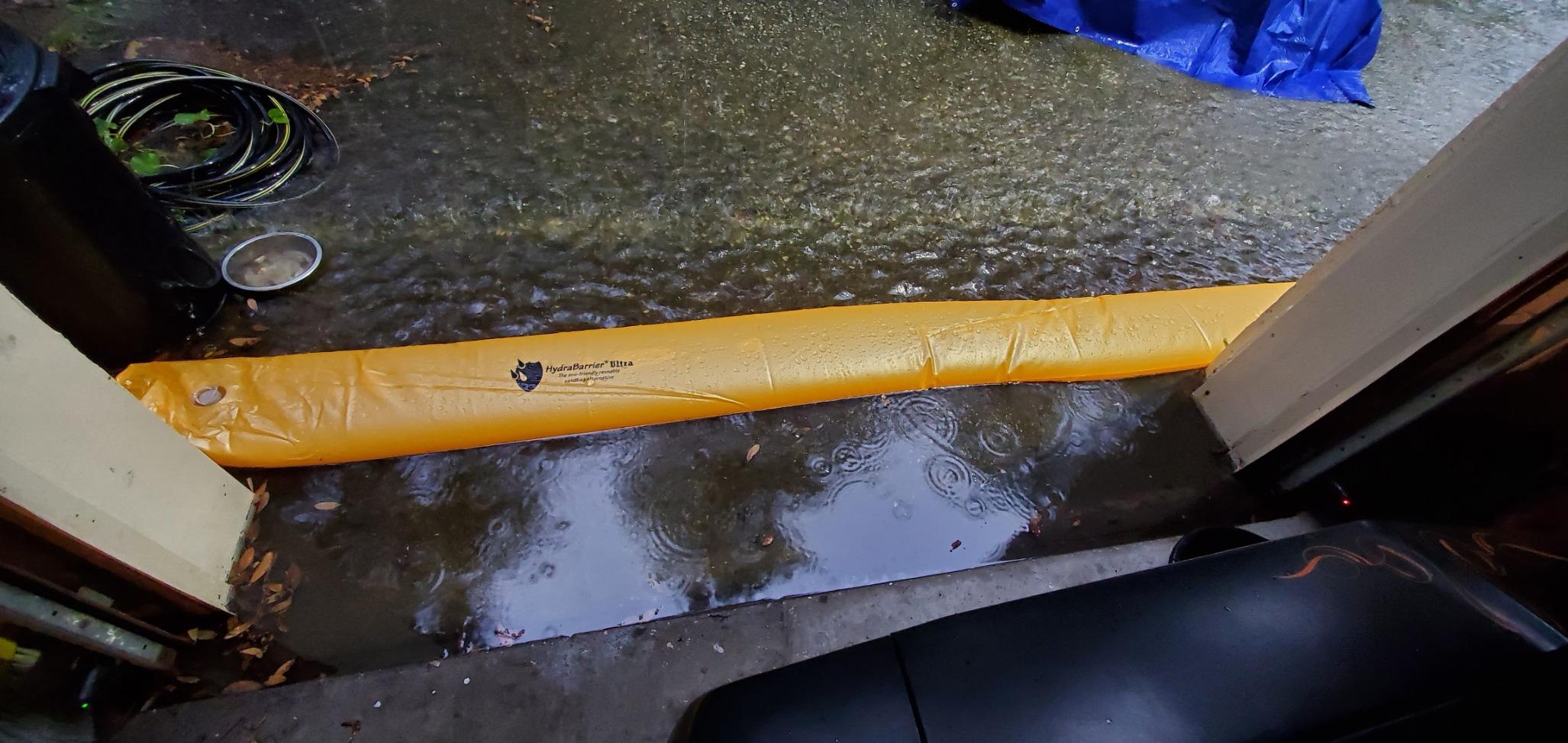 The Original HydraBarrier Ultra Flood Barrier – 12 ft Long x 6 in High – Light, Reusable Sandbag Alternative – Flood Control & Diversion Tube for Home, Garage, Door & Property Protection customer photo 1